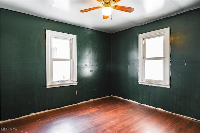 unfurnished room featuring ceiling fan and wood-type flooring