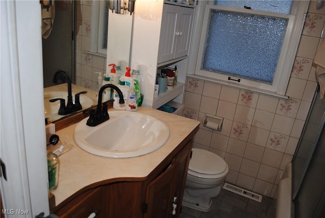 bathroom with toilet, walk in shower, vanity, tile walls, and radiator heating unit