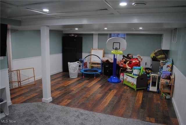 game room featuring dark wood-type flooring