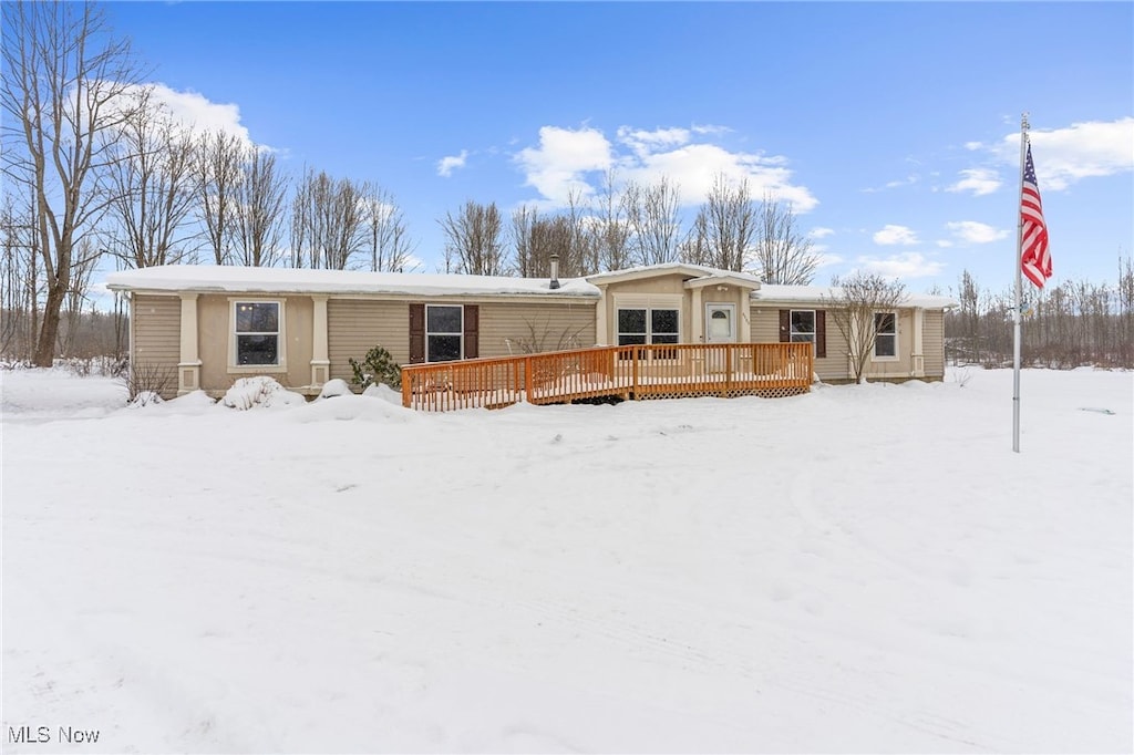 view of front of property with a wooden deck