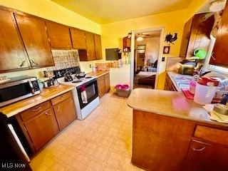 kitchen featuring electric range