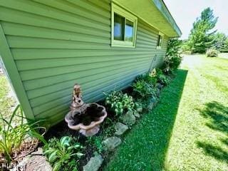 view of property exterior featuring a yard