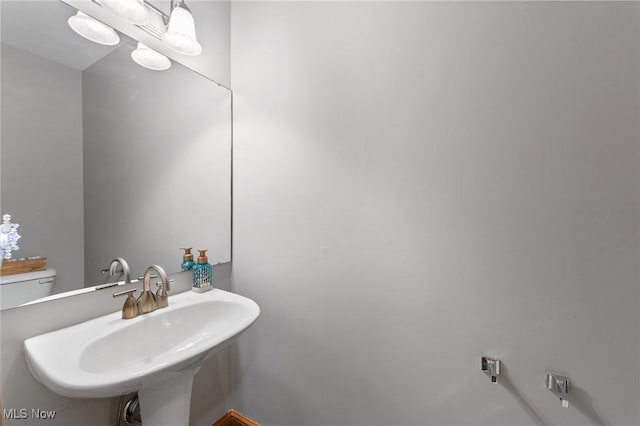 bathroom with sink and toilet