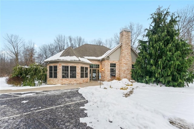 view of snow covered house