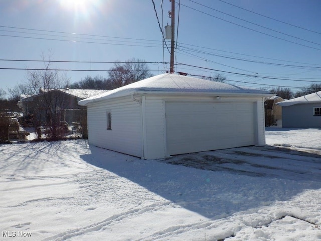 view of snow covered garage