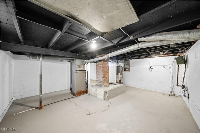 basement featuring electric panel and gas water heater