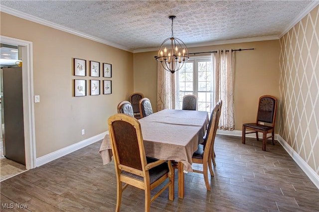 dining space featuring an inviting chandelier, crown molding, and wood-type flooring