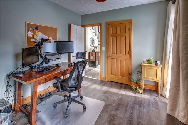 office space featuring a textured ceiling and hardwood / wood-style floors