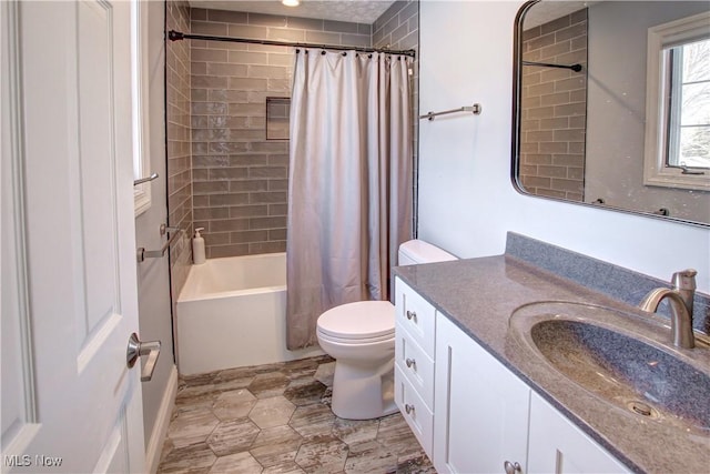 full bathroom with shower / bath combination with curtain, vanity, and toilet