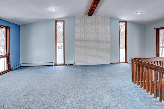 empty room with lofted ceiling with beams, carpet floors, a textured ceiling, and a baseboard heating unit