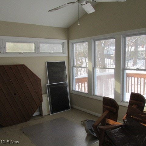 interior space featuring ceiling fan and vaulted ceiling