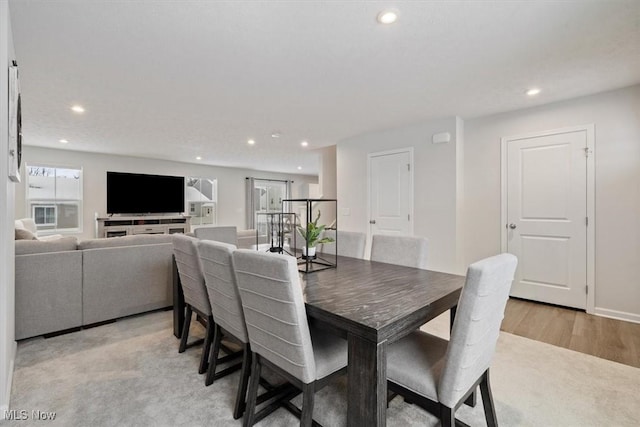 dining space with light hardwood / wood-style flooring