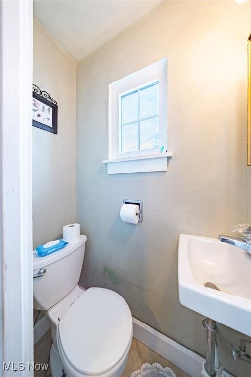 bathroom with sink and toilet