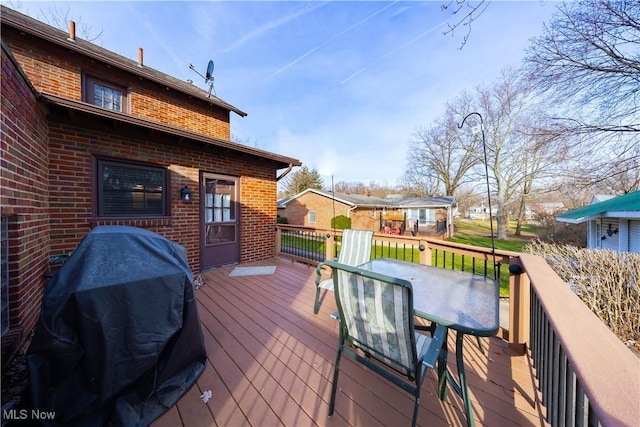 wooden deck with grilling area