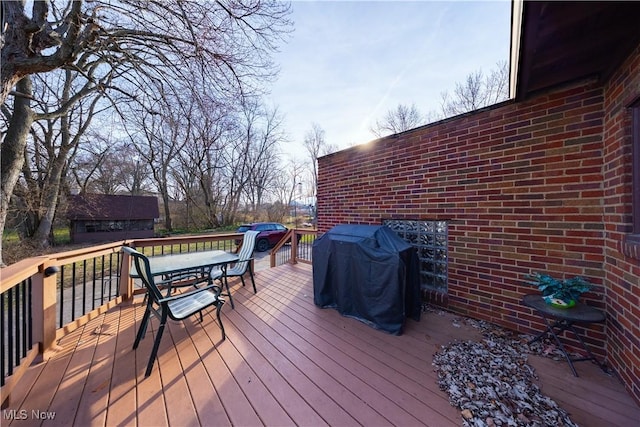 wooden deck with grilling area