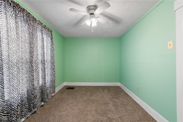 unfurnished room featuring a textured ceiling, ceiling fan, and carpet flooring