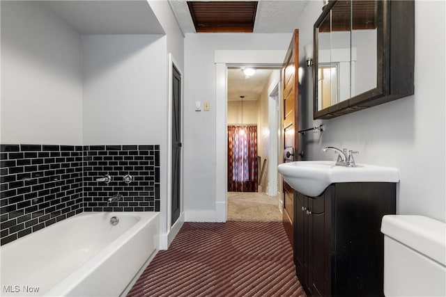 bathroom with toilet, vanity, and a tub to relax in