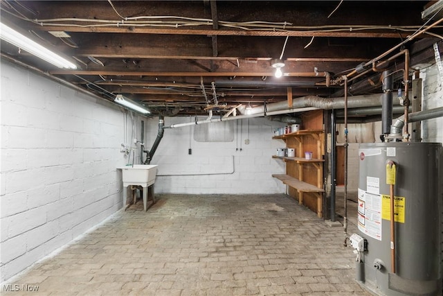 basement featuring gas water heater and sink