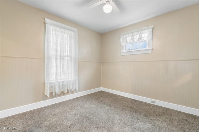 unfurnished room featuring carpet flooring and ceiling fan