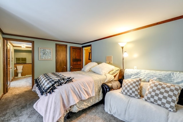 bedroom with crown molding, connected bathroom, and carpet