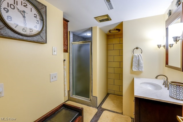 bathroom featuring vanity and walk in shower