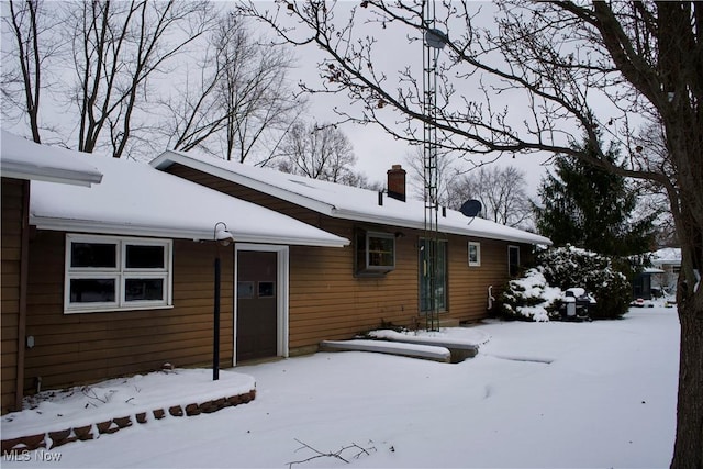 view of snow covered house