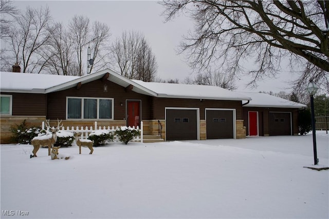 ranch-style house featuring a garage