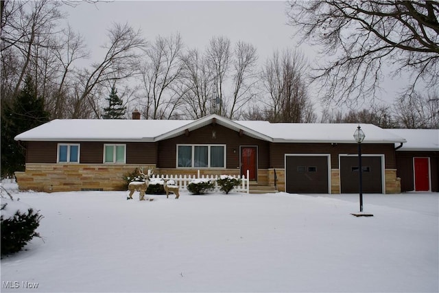 ranch-style house featuring a garage