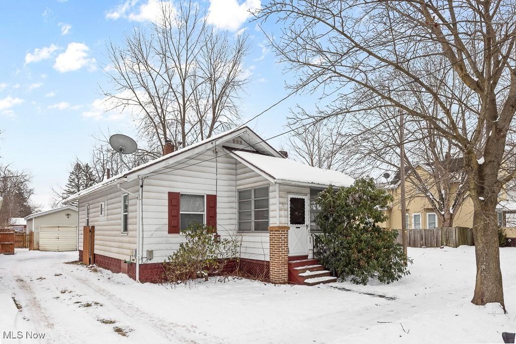 bungalow-style home with a garage