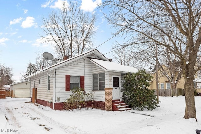 bungalow-style home with a garage