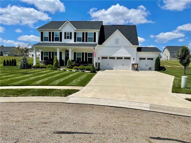 colonial home with a front yard, a garage, and a porch