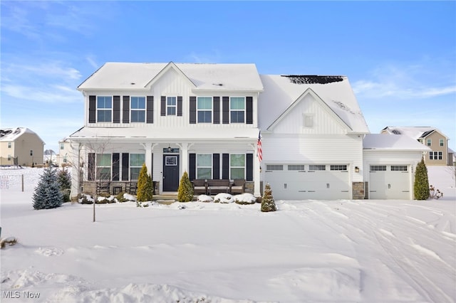 view of front of house featuring a garage and a porch