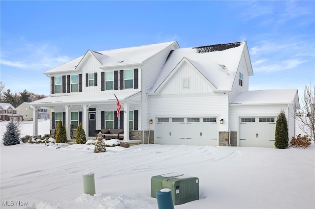 view of front of property featuring a garage and covered porch