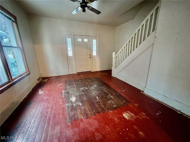 foyer entrance featuring dark hardwood / wood-style flooring, ceiling fan, and a healthy amount of sunlight