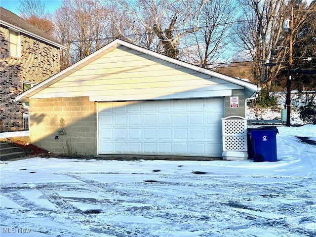 view of snow covered garage