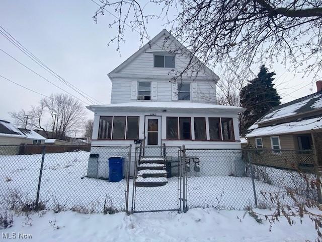 view of front of property with a sunroom