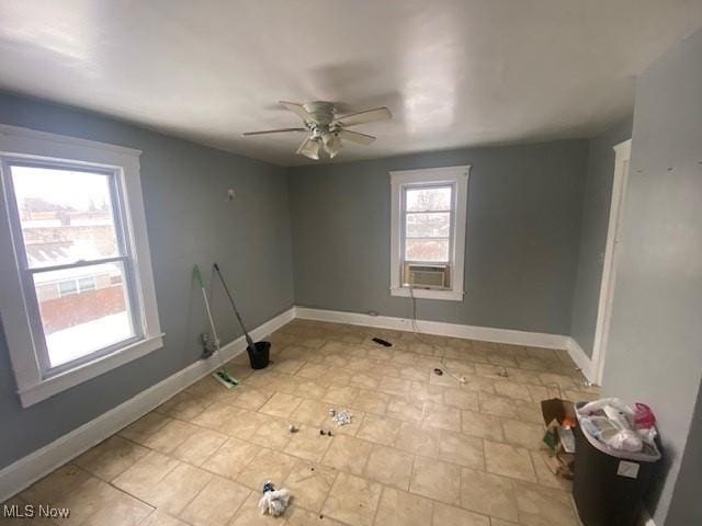 unfurnished room with ceiling fan