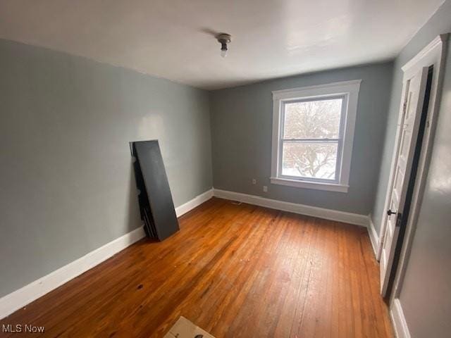 unfurnished bedroom with wood-type flooring