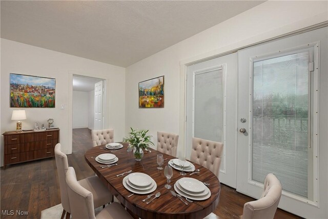 dining area featuring dark hardwood / wood-style floors