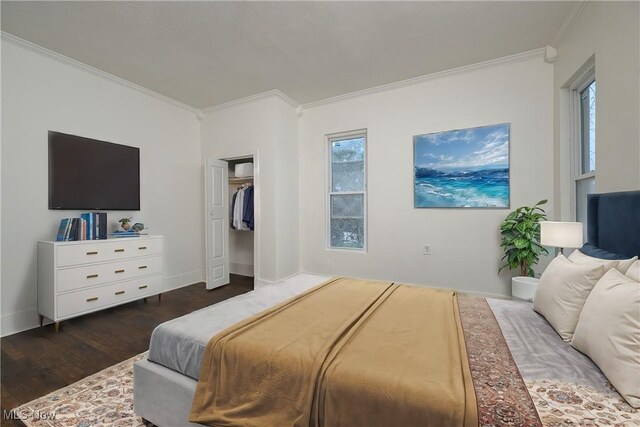 bedroom featuring dark wood-type flooring and crown molding