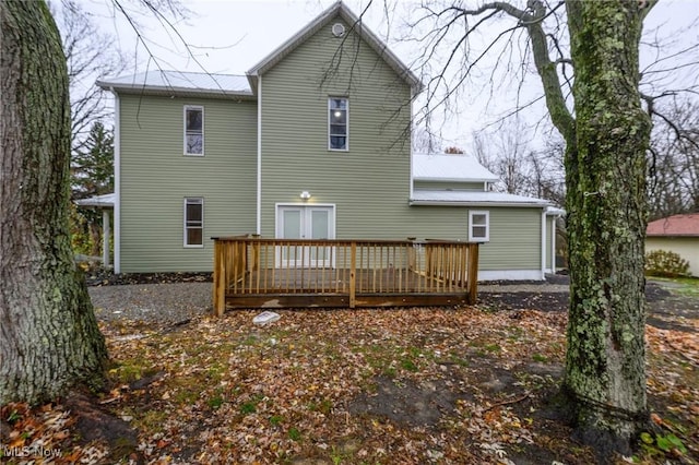 rear view of property with a deck