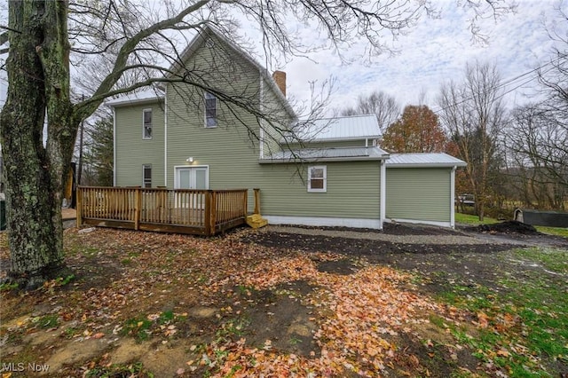 rear view of property with a deck