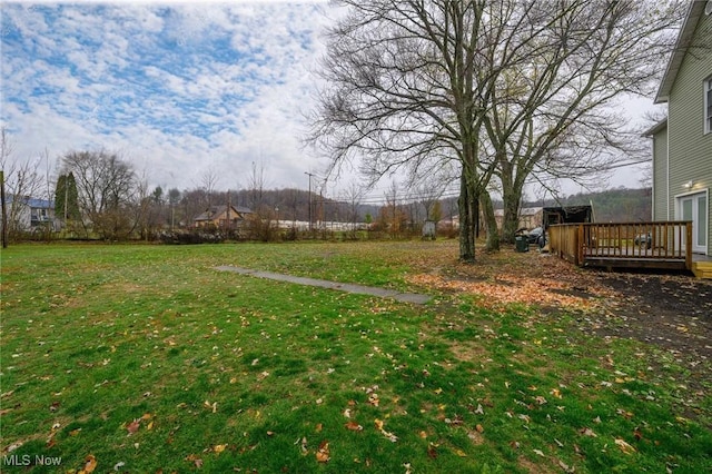 view of yard with a deck