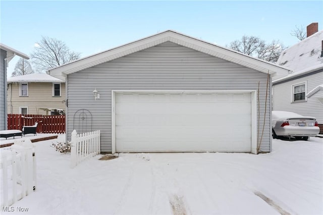 view of snow covered garage