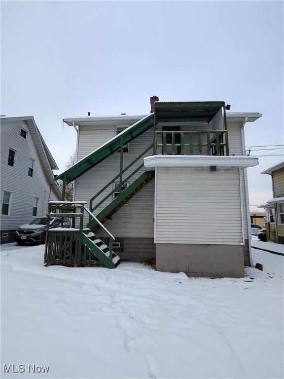 view of snow covered house