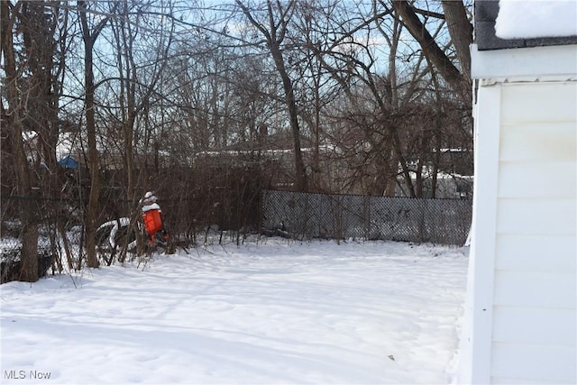 view of yard layered in snow