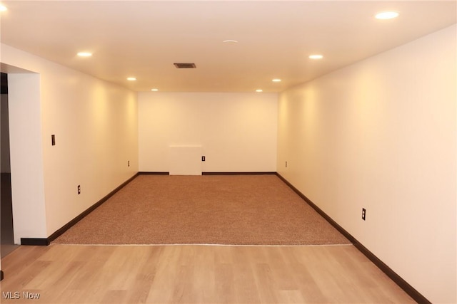 empty room with light hardwood / wood-style floors