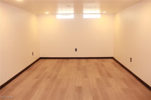 basement featuring light wood-type flooring