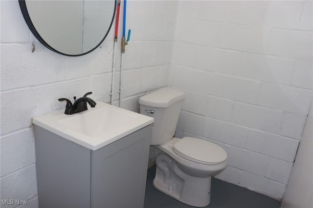 bathroom with toilet and vanity