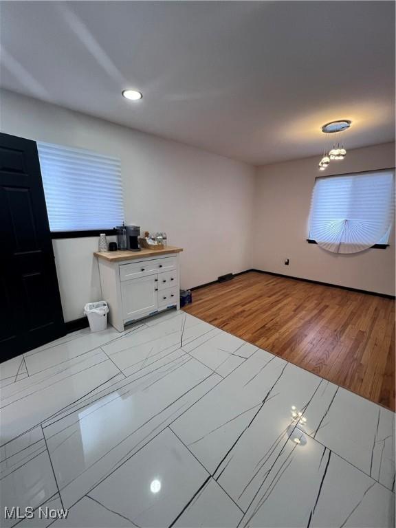 spare room featuring light wood-type flooring